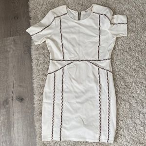 White dress with gold studs